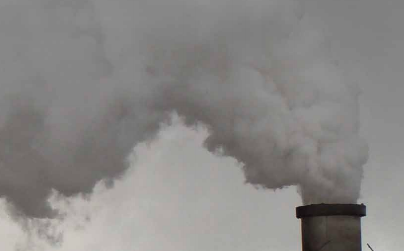 Photo of a grey steam power plant