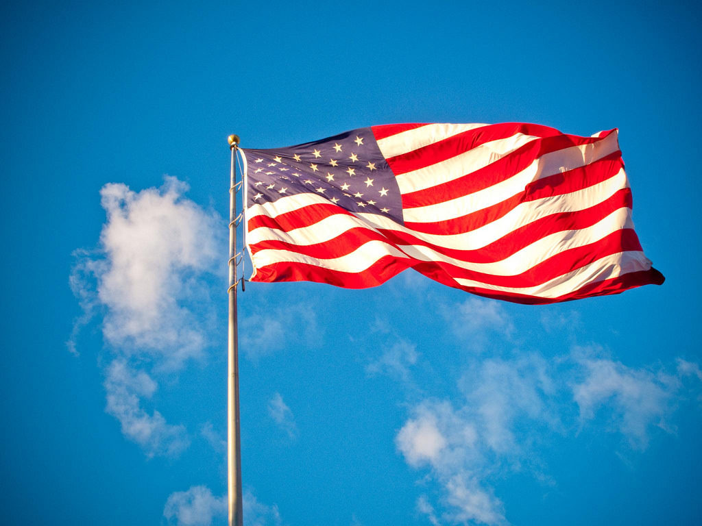 Photo of the USA flag blowing in the wind