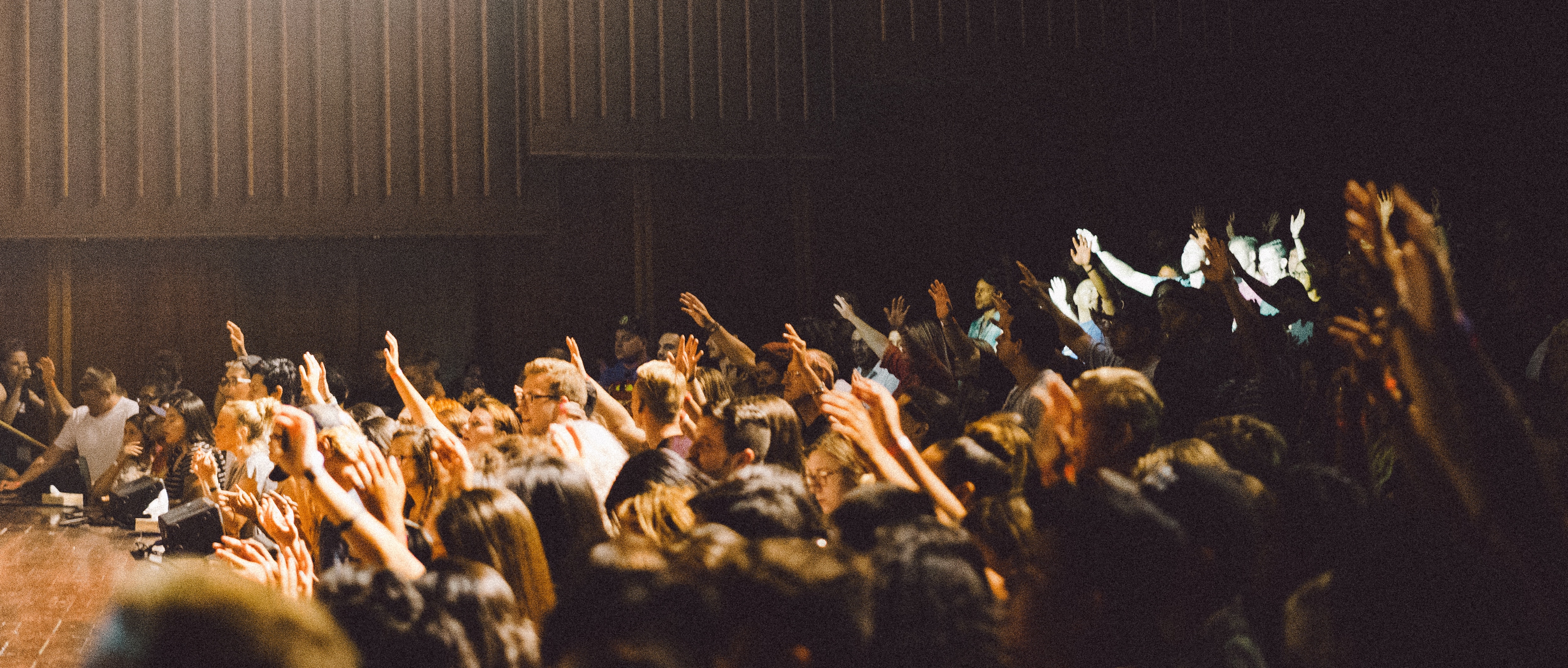 Photo of people gathered around a stage