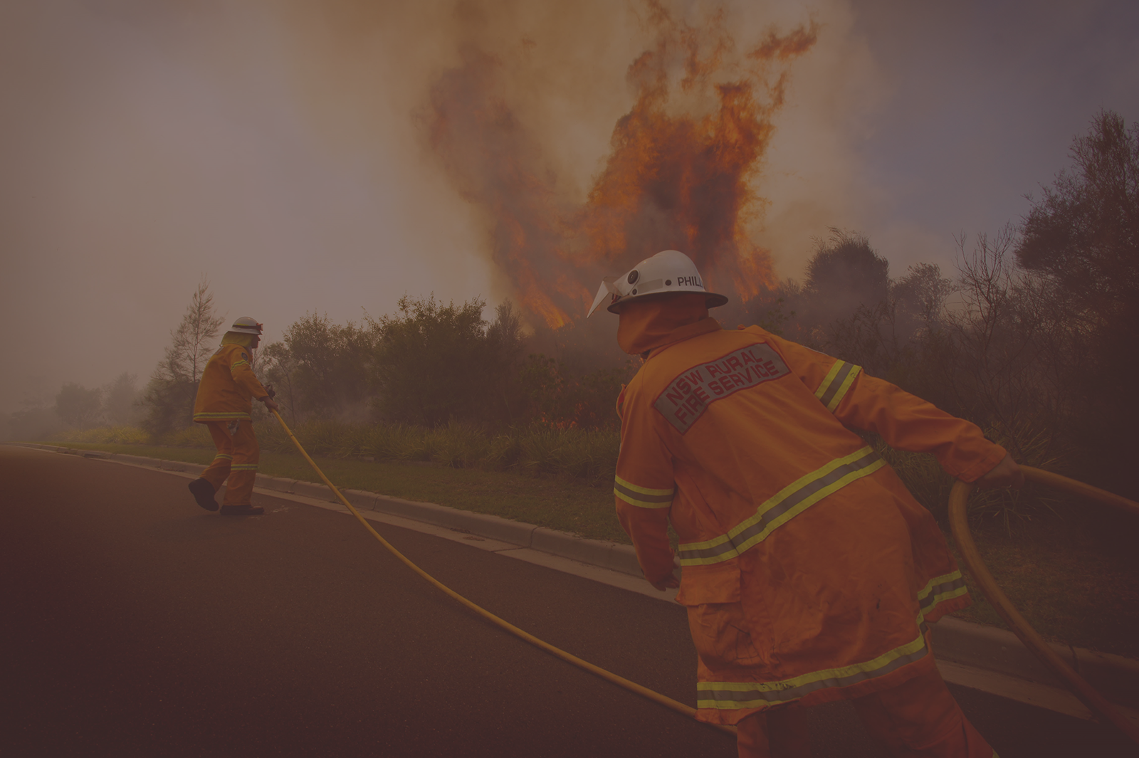 Photo of firemen putting out bushfire