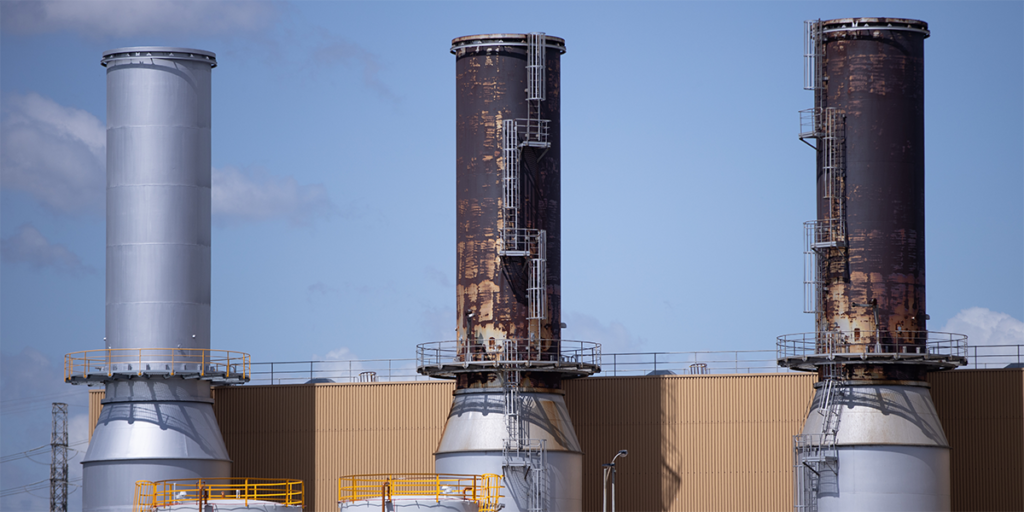 Gas report, Passing Gas, front cover image of a trio of gas towers