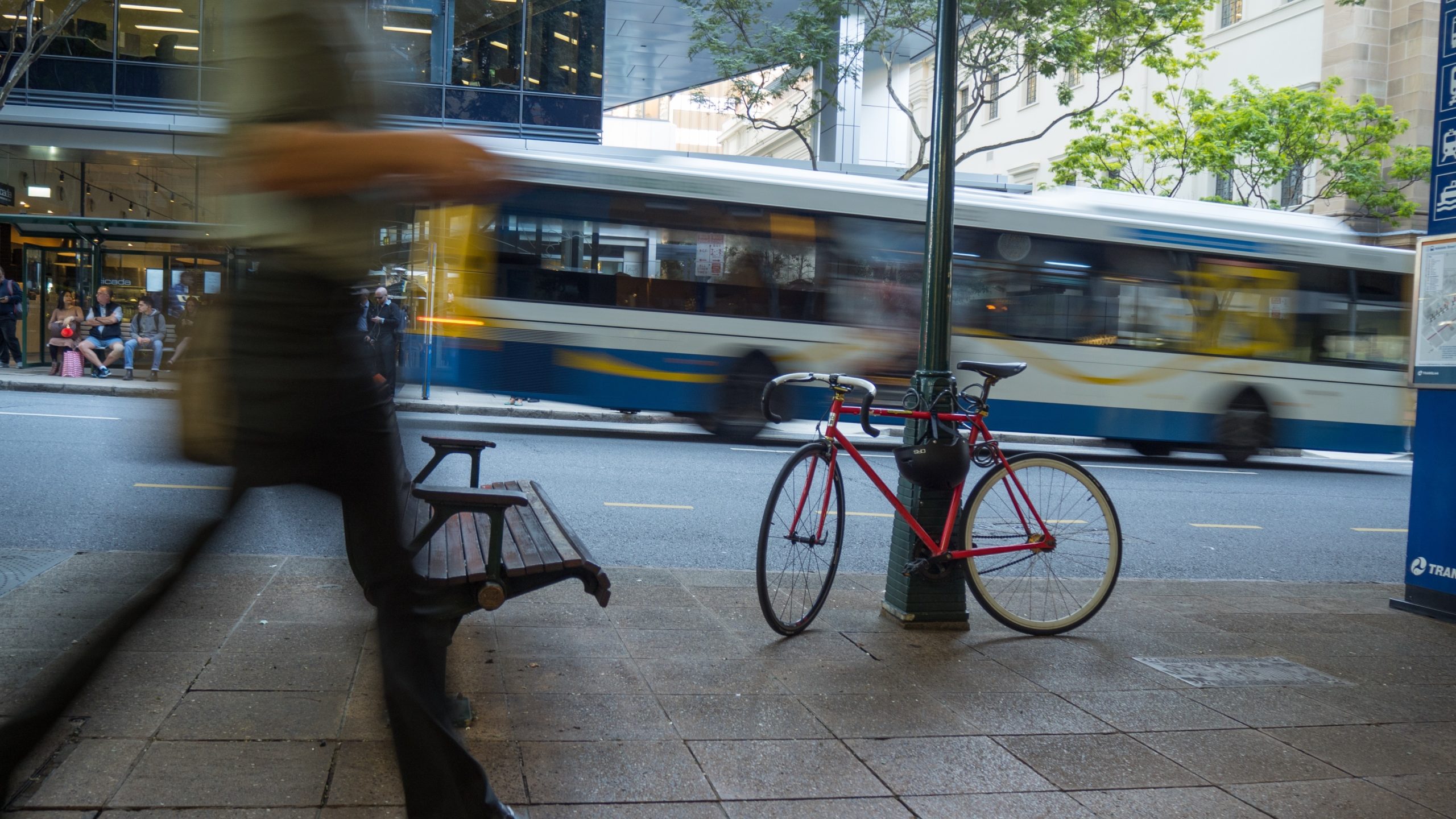 A bicycle chained to a lamppost