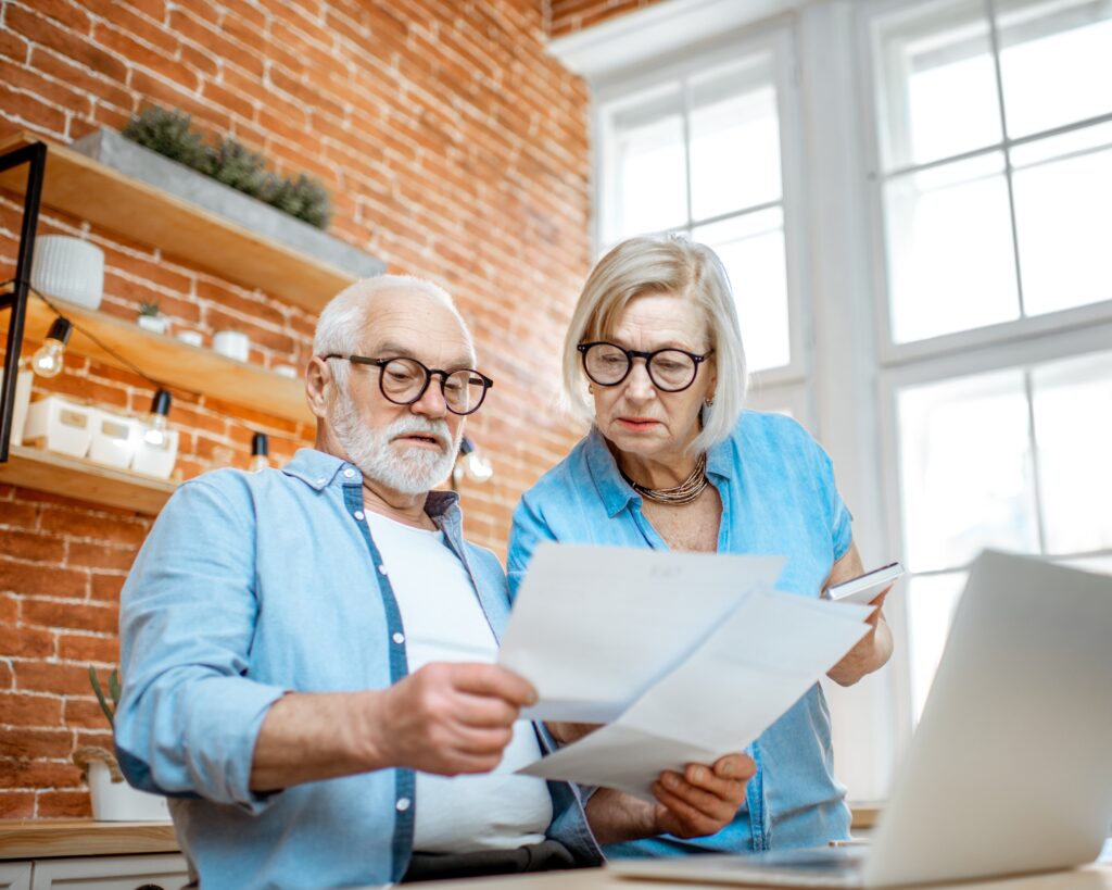 older couple looking at bill